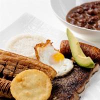Bandeja El Cartel · A well packed dish consisting of steak, egg, rice, red beans, chicharron, sweet plantain,
Co...