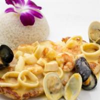 Pechuga Buenaventura · Juicy chicken breast topped with a fresh creamy seafood sauce containing shrimp, mussels, cl...