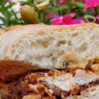 Chicken Sandwich · Buttermilk fried chicken breast, roasted peppers, lettuce, onions, poblano ranch