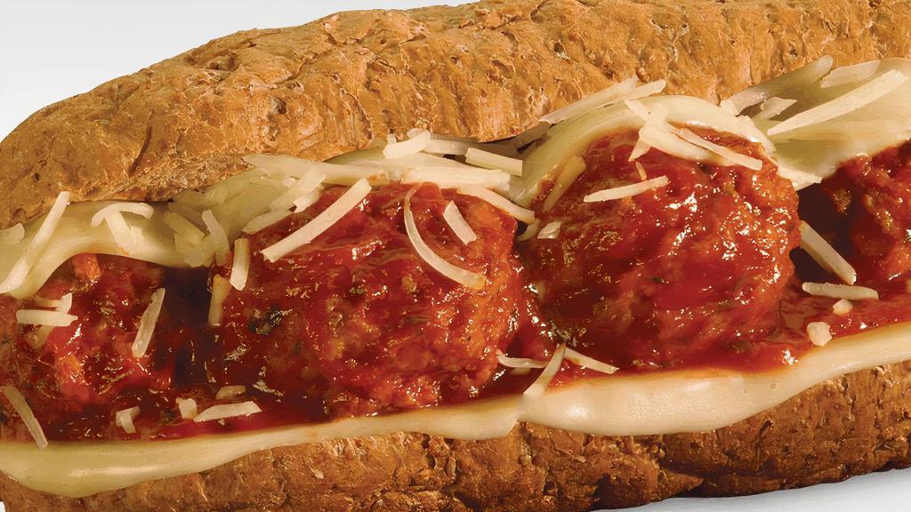 Meatball Parmigiana · Italian beef/pork blended meatballs smothered in a zesty marinara sauce with melted provolone and sprinkled with parmesan