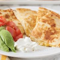 Chicken Quesadilla · Traditional quesadilla served with grilled chicken, mixed cheese & sour cream