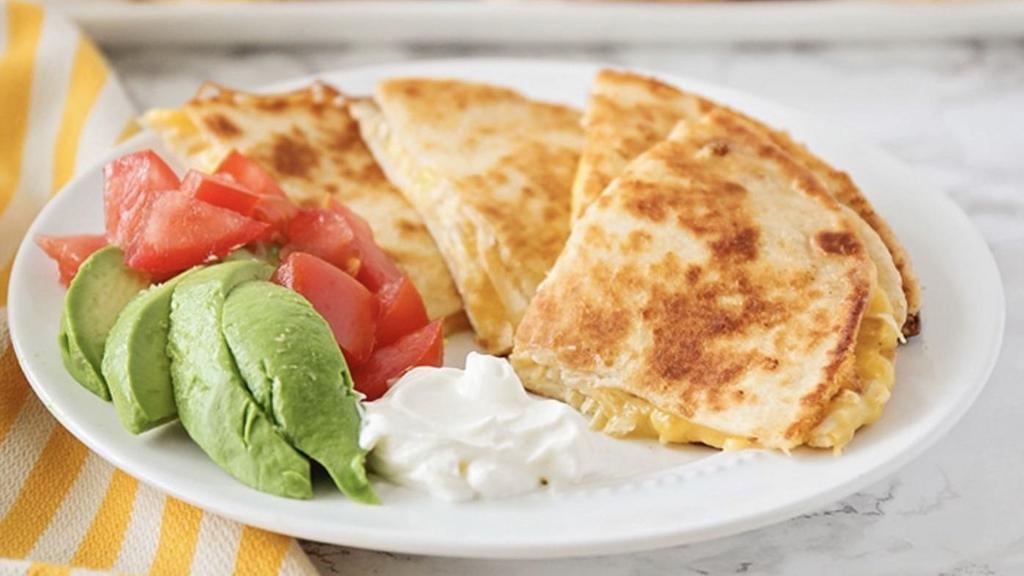 Chicken Quesadilla · Traditional quesadilla served with grilled chicken, mixed cheese & sour cream