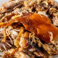 Roasted Pork · Comes with the option of either white rice, yellow rice, rice with pigeon peas, or vegs.