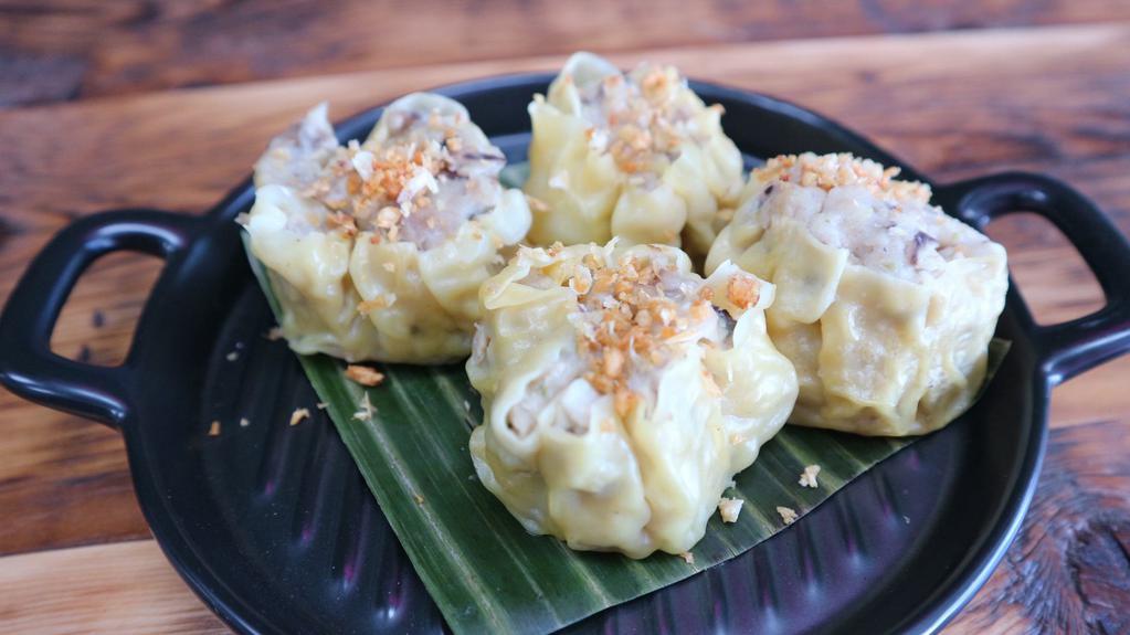 Thai Dumplings (4) · Steamed or fried dumpling filled with minced chicken, served with sweet soy sauce.