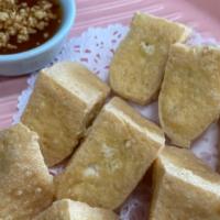 Golden Fried Tofu (8) · Vegan. Deep fried tofu, served with sweet chili sauce and peanut.
