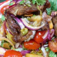 Crispy Duck Salad · Roast duck salad mixed with cashew nut, pineapple, tomatoes and Thai chili paste.