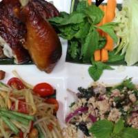 Isan Set · Thai northeastern food with papaya salad, roasted chicken, larb, sticky rice.