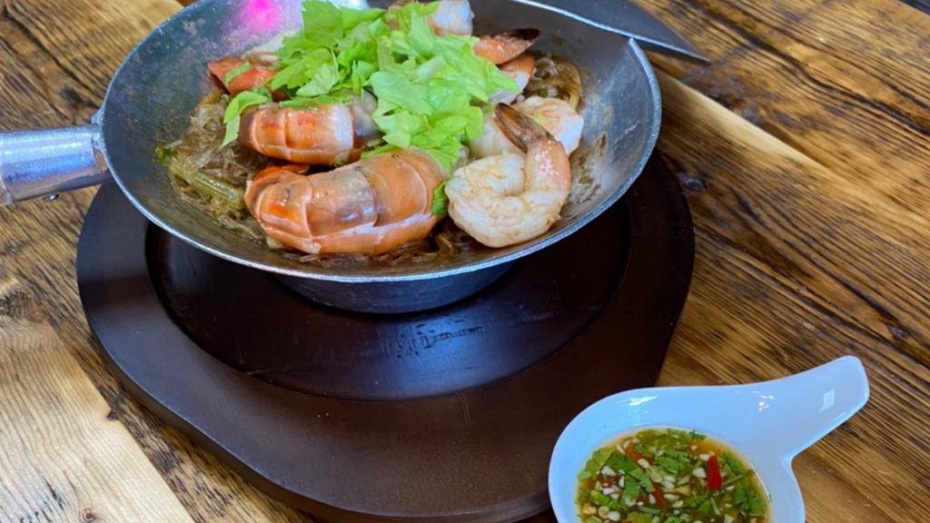 Goong Ob Woon Sen · Glass noodles with jumbo shrimp, napa, onion, celery, ginger, garlic and black pepper in sesame oil.