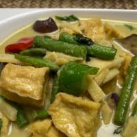 Green Curry · Spicy. Thai style coconut milk green curry with bamboo shoot, eggplant, string bean, basil l...