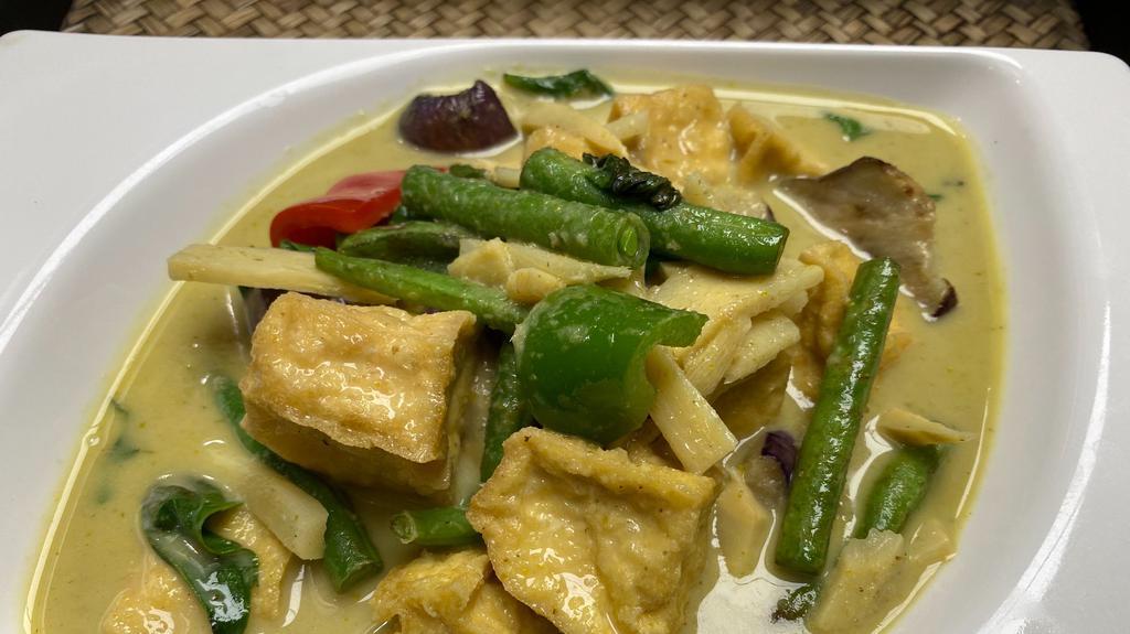 Green Curry · Spicy. Thai style coconut milk green curry with bamboo shoot, eggplant, string bean, basil leave and bell pepper.