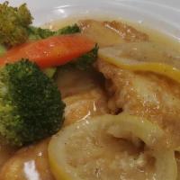 Pollo Francese (Chicken Francese) · Chicken dipped in butter, fried, simmered in white wine and lemons.