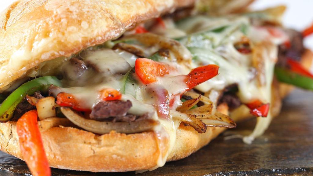 Philly Cheesesteak With Lettuce, Tomatoes, And Mayo · Thinly sliced steak with melted cheese, lettuce, tomatoes, and mayo on a fresh-baked roll.