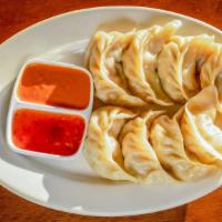 Momo · A type of dumpling that's traditional to Tibet, stuffed with a mix of minced onion, coriande...