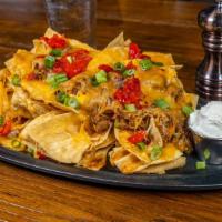 Blu Nachos · Blu Alehouse favorite: Tortilla chips layered with chili, slow roasted bbq pulled pork, ched...