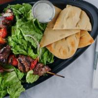 Blu Kabob · Blu Alehouse favorite: Your choice of marinated beef or chicken skewers served over our Medi...