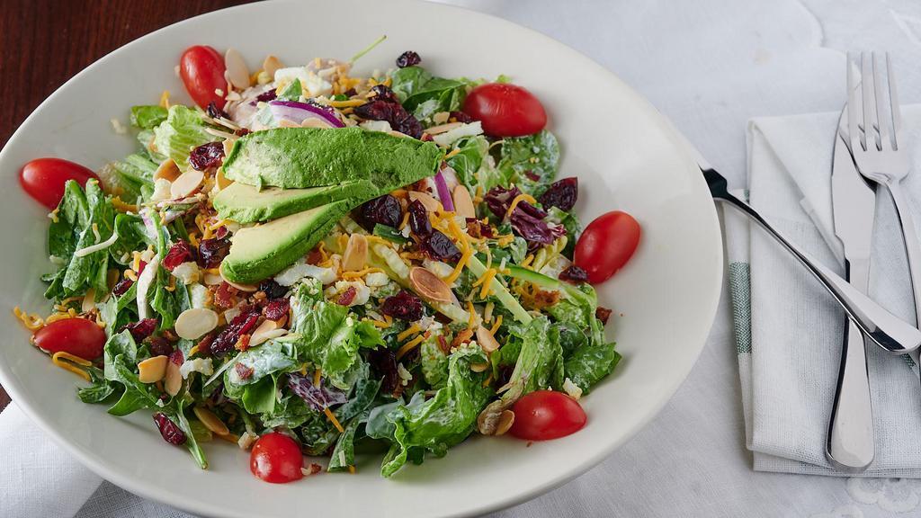 California Cobb · Blu Alehouse favorite: Mixed greens tossed in our ranch dressing with avocado, red onion, roasted chicken, egg, bacon, craisins cheddar jack cheese, toasted almonds, tomatoes, cucumbers.