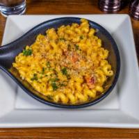 Lobster Mac & Cheese · Maine lobster tossed in house-made cheese sauce and cavatappi pasta topped with garlic bread...