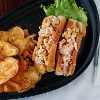 Lobster Rolls · Maine lobster with sautéed corn, grilled tomatoes, herbs, and our signature sauce on new Eng...