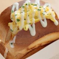 K Classic Egg Toast · Fluffy scrambled eggs stuffed inside a savory brioche toast with sriracha mayo and topped of...