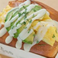 Avocado Egg Toast · Fluffy scrambled eggs stuffed inside a savory brioche toast. Lathered with our homemade avoc...