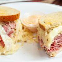 Reuben · Sliced corned beef or pastrami with melted Swiss, sauerkraut and Russian dressing on toasted...