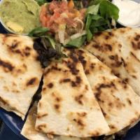 Quesadilla · Flour Tortillas with Mozzarella Cheese, Sautéed Mushrooms, Onions, and Jalapeño Peppers. Add...