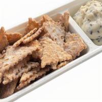 Cannoli Chips & Dip · Delicious cannoli chips served with fresh cannoli cream dip with chocolate chips.