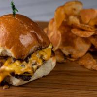 Mel'S Double Burger · With caramelized onions, melted American cheese and Mel's secret sauce. Served with house ma...
