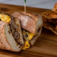 Rib Eye Cheese Steak · With caramelized onions, melted American cheese and steak sauce aioli. Served with house mad...
