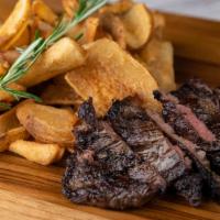 Steak Frittes · Marinated pat lafrieda skirt steak with seasoned house fries and steak sauce aioli.