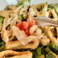 Calamares Frito · Crisp calamari salad with chili lime aioli.