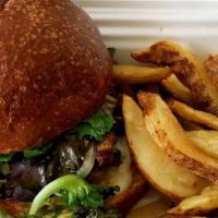 Beef Burger · 6 oz burger served with caramelized onions, sauteed shitake mushrooms, baby greens, pepperja...