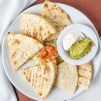 Grilled Quesadilla · A grilled flour tortilla stuffed with charbroiled chicken, steak, or shrimp and jack cheese....