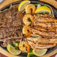 Fajitas - Mixed Combo (2) · Sizzling tender pieces of marinated steak, chicken or shrimp sautéed with fresh bell peppers...