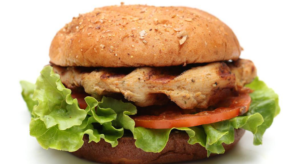 Classic Grilled Chicken Sandwich · Delicious sandwich made with perfectly grilled Chicken, lettuce, tomatoes, and herb mayo, served on a brioche bun.