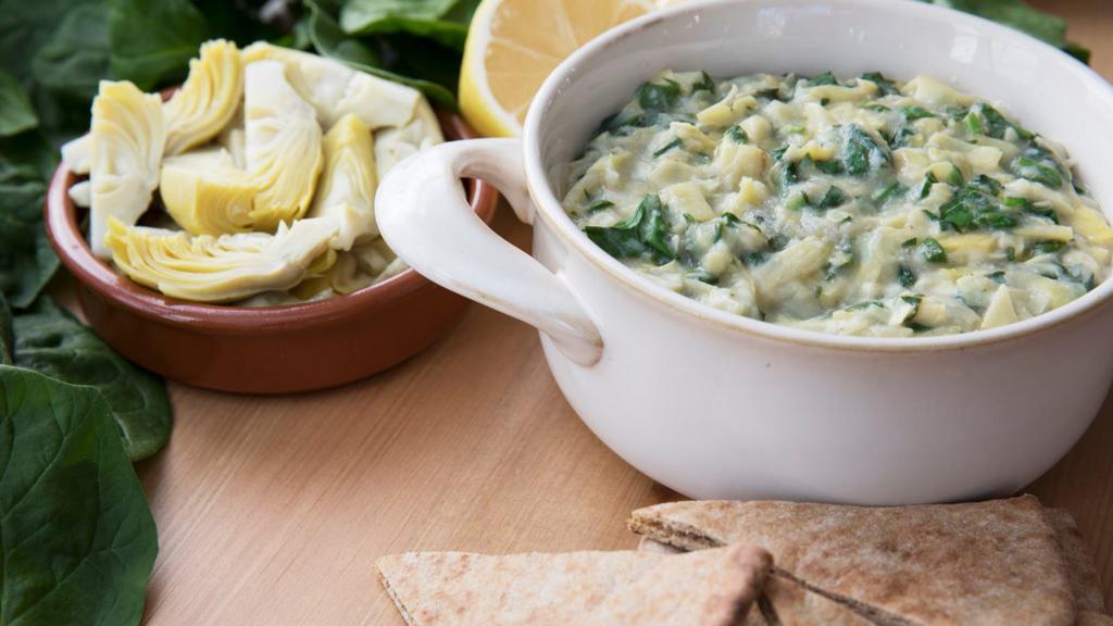 Creamed Spinach · Fresh spinach mixed with a house special heavy cream.