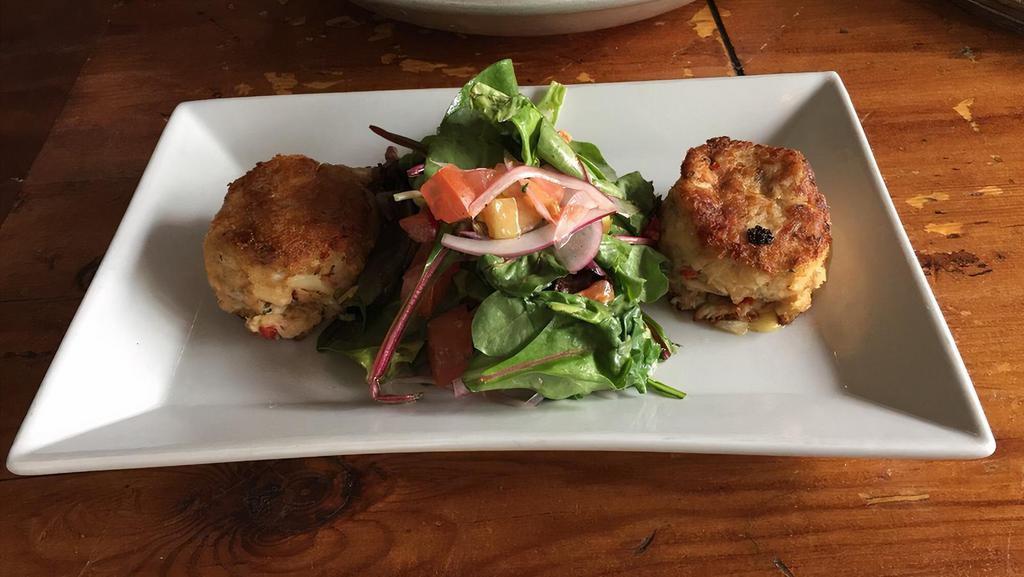 Maryland Style Crab Cakes · Pan-Seared Chunks of Crab Meat Served with a Small Salad & Garlic Aioli.
