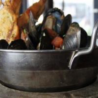 Mucho Mussels · PEI Mussels with Basil, Tomato, White Wine & Garlic.