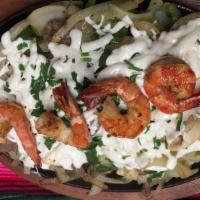 Alambre Mixto · Sautéed chicken, steak and shrimp with green peppers, onions, and melted Mexican cheese.