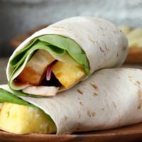 Hawaiian Bomb Wrap · Quarter pound of handcrafted chicken tenders, lettuce, tomatoes, onions, Cheddar cheese, gri...