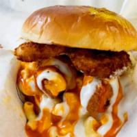 The Mac Bomb · Quarter pound of handcrafted chicken tenders, mac and cheese, onion rings, buffalo and blue ...