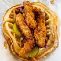 Waffle Bomb · Quarter pound of handcrafted chicken tenders, coleslaw, pickles and maple sauce on a fresh h...