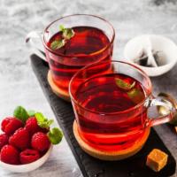 Pomegranate Raspberry Tea · Delicious hot cup of pomegranate raspberry tea freshly brewed.