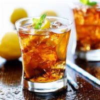 Unsweetened Iced Tea · Delicious cup of unsweetened iced tea served with lemon wedges.