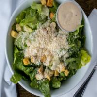Caesar Salad · Fresh Romaine lettuce tossed in a creamy, homemade Caesar dressing and topped with parmesan ...