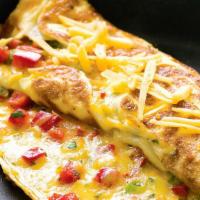 Mexican Omelette · With jalapeño peppers, onions and cheddar cheese topped with salsa.