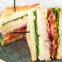 Triple Decker · Ovengold Turkey Breast, Swiss Cheese, Crispy Bacon, Lettuce, Tomatoes, and Mayo Stacked on y...