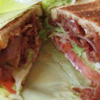 L.T. · Crispy bacon, lettuce, tomatoes and mayo stuffed on white toast