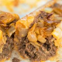 Philly Cheesesteak Sub · Philly cheesesteak sub topped with cheddar cheese, grilled onions, peppers and mushrooms.