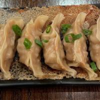 Original Pork Dumpling · Six pieces. Ground pork with onions and cabbage. Served with the dumpling sauce, chili oil, ...